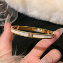 Pulseira de aço titânico e ouro